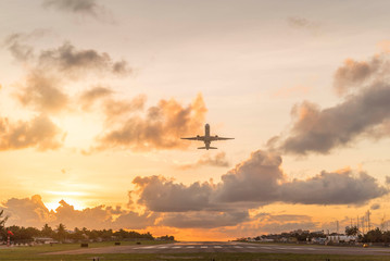 Plane taking off during sunset on st.maarten