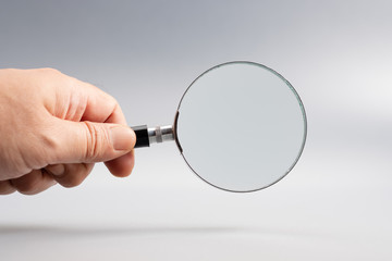 Hand with Magnifying Glass