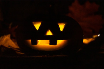 A terrible pumpkin glows in the night. halloween
