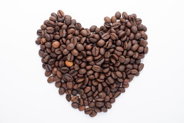 Heart made from coffee beans isolated on white background. Coffee shop concept
