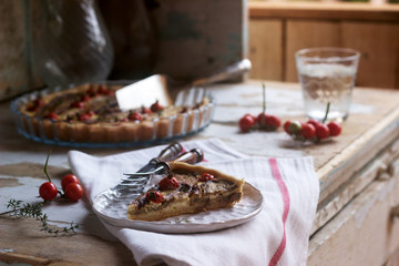 Pie stuffed with vegetables, cottage cheese and cream on a wooden background. Rustic style.