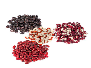 red, black and spotted beans isolated on a white background