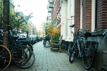 many bicycles on street of Amsterdam city, parking ideal traffic eco healthy lifestyle concept at sunlight, health care stuff