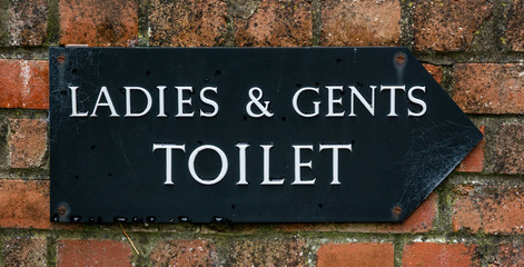 Old ladies and gents toilet sign