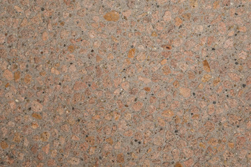 Gros plan texture béton désactivé avec graviers rose