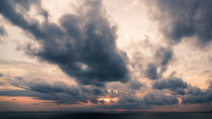Beautiful view of sky and cloud at dusk,Sky Bright Blue Orange And Yellow Colors in twilight after sunset time.