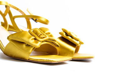 Yellow female sandals on white