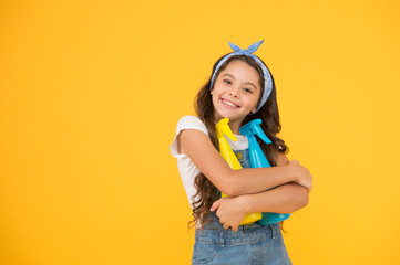 Cleaning products that work. Happy little girl enjoy doing house work. Cute small child ready for cleaning work. Clean home is our work, copy space
