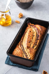 Banana bread on light concrete background. Copy space.