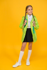 Rain is not hindrance. Waterproof cloak. Schoolgirl wear green raincoat going to school. Waterproof fabric for your comfort. Rainproof accessory. Waterproof clothes. Kid girl happy wear raincoat