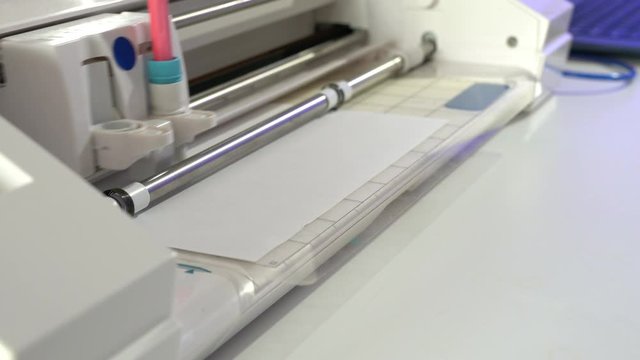 A drawing plotter draws a schematic of industrial details. Device design