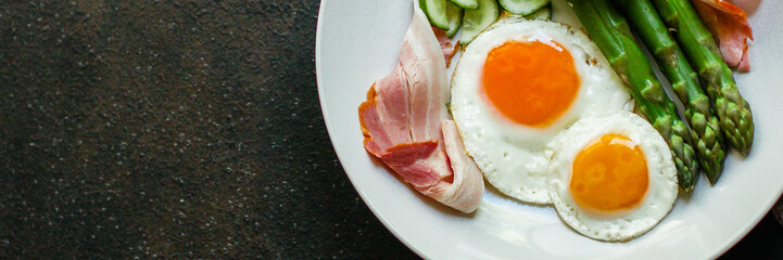 healthy breakfast (fried eggs, bacon, vegetables, asparagus beans, coffee and more) menu concept. food background. copy space. Top view