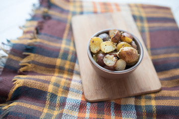 Delicious Roasted mini potato with spices and Parmesan cheese, cut in halves