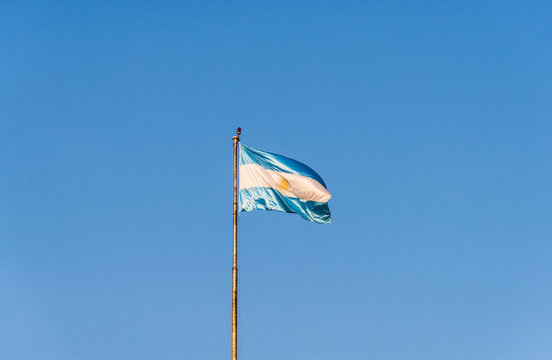 Argentina flag waving against blue sky on a sunny day 