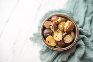 Delicious Roasted mini potato with spices and Parmesan cheese, cut in halves