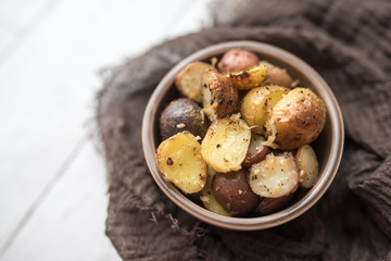 Delicious Roasted mini potato with spices and Parmesan cheese, cut in halves