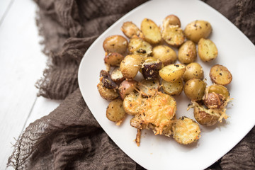 Delicious Roasted mini potato with spices and Parmesan cheese, cut in halves