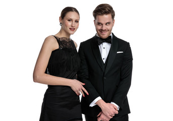 Girlfriend posing beside boyfriend that is making a funny face