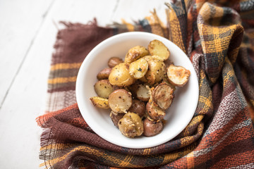 Delicious Roasted mini potato with spices and Parmesan cheese, cut in halves