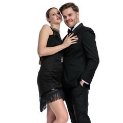 Seductive girlfriend touching his boyfriend that is embracing her