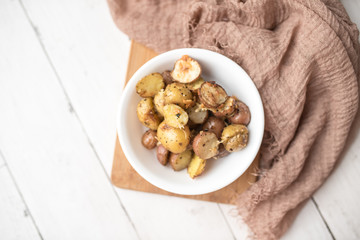 Delicious Roasted mini potato with spices and Parmesan cheese, cut in halves