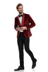 happy young fashion model wearing red velvet tuxedo
