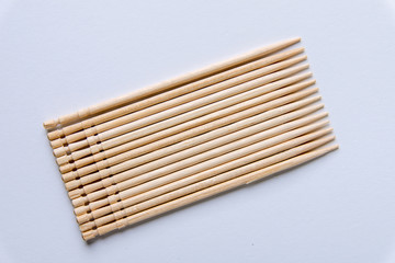 Toothpicks on a white background. From above. Text space