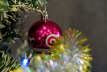 Christmas tree with different toys. New Year tree. Christmas tree. The painting depicts a fragment of a New Year tree with different toys 