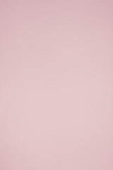 pastel pink background with slight texture