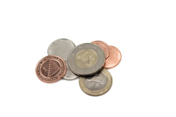 A close up of a pile of old coins from Bosnia Herzegovina isolated on a white background.  Shot in macro.