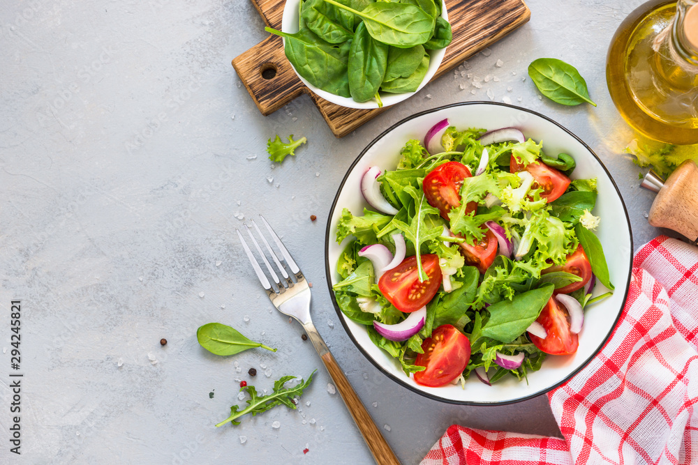 Canvas Prints green salad from fresh leaves and tomatoes.