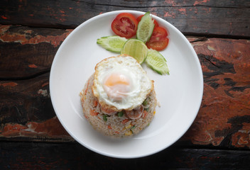 Top view Thai food shrimp fried rice isolated on rustic wooden table