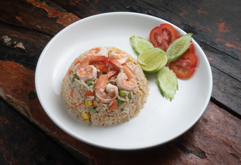 Top view Thai food shrimp fried rice isolated on rustic wooden table