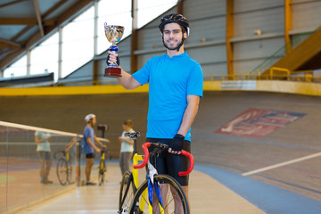 Obraz premium cyclist wins a bike trophy