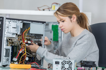 student girl in electronics laboratory