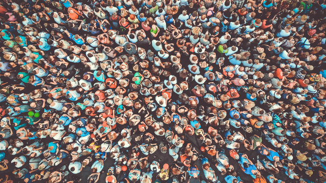 Aerial. People crowd background. Mass gathering of many people. Top view. Toned.