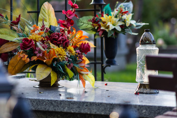 Autumn alley at the cemetery before the All Saints Day