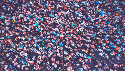 Aerial. Many people background. Top view. Toned.