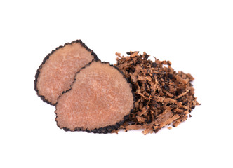 Grated Truffle. Fresh black truffles isolated on a white background. Delicacy exclusive truffle mushroom. Piquant and fragrant French delicacy. Clipping path.