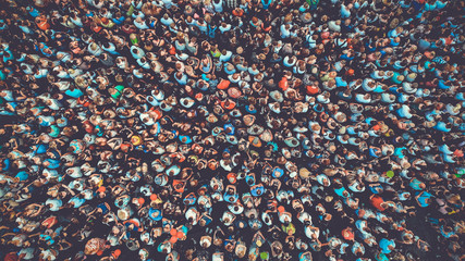 People crowd texture background. Bird eye view. Toned. - Powered by Adobe