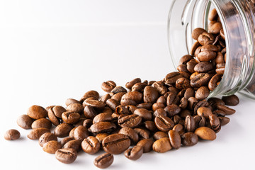 Coffee beans on a white background. Three coffee beans. Fried arabica beans.