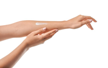 Female hands with cream on white background