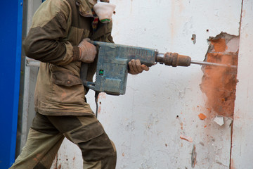 Jackhammer. The use of a jackhammer in construction works.