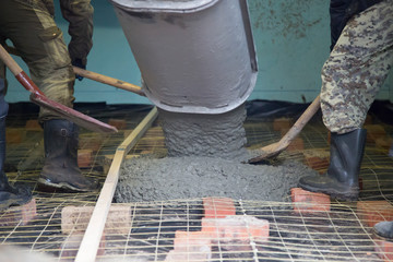Concrete.Concrete mixer on the car. Fill the floor with concrete.