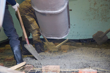 Concrete.Concrete mixer on the car. Fill the floor with concrete.