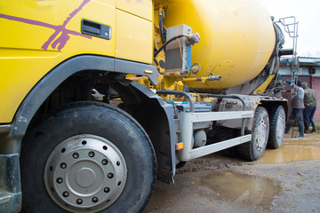 Concrete.Concrete mixer on the car. Fill the floor with concrete.