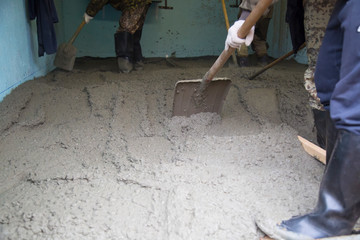 Concrete.Concrete mixer on the car. Fill the floor with concrete.