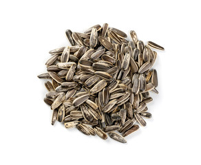Pile of large striped sunflower seeds with shell isolated