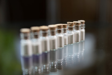 white powder in a glass jar. Poison or drug or cosmetic