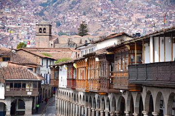 Fototapeta na wymiar Cusco, Peru - Sept 26, 2019: Balconies and architecture of Cusco's Plaza de Armas